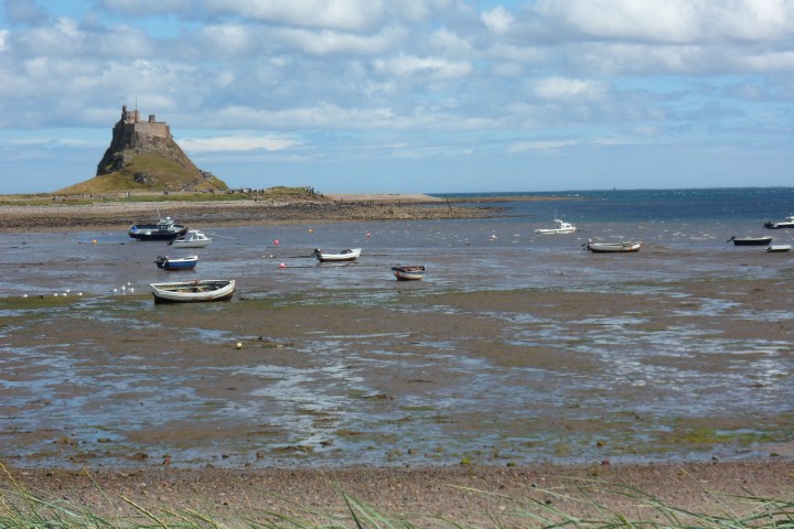 Fishing boats and castle near Lindisfarne